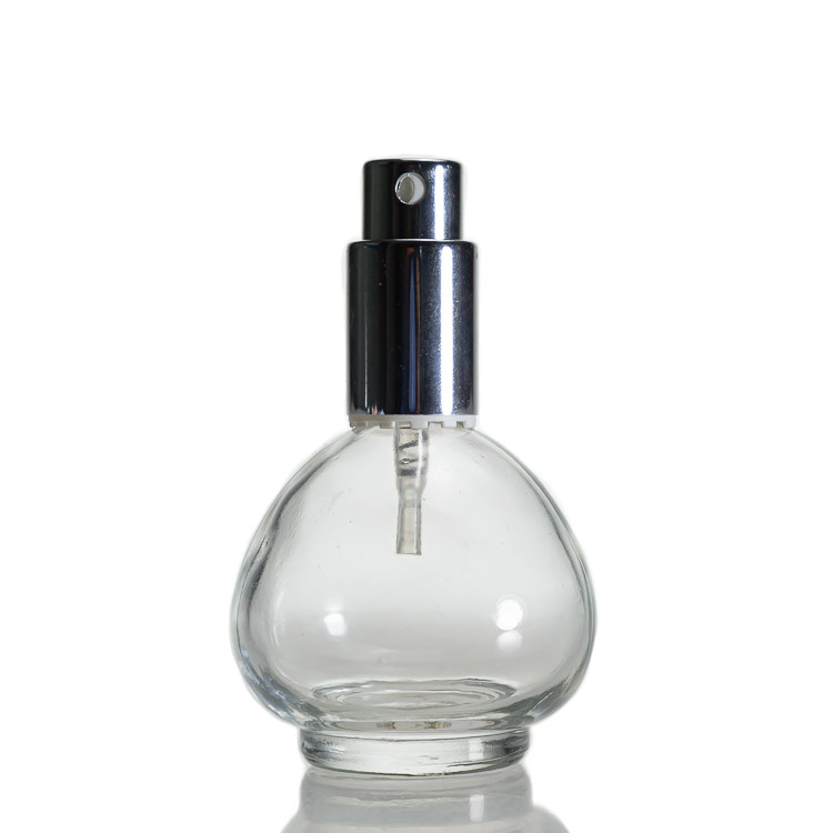 Wholesale Oil Perfume Bottle Clear Empty Glass Round 50ml Glass Spray Perfume Bottle with Cap